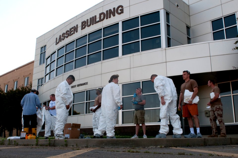 US Navy 100506-N-5319A-001 Personnel assigned to the Office of the Chief of Naval Operations at Naval Support Activity Mid-South prepare to enter their workspaces to remove office supplies and personal items