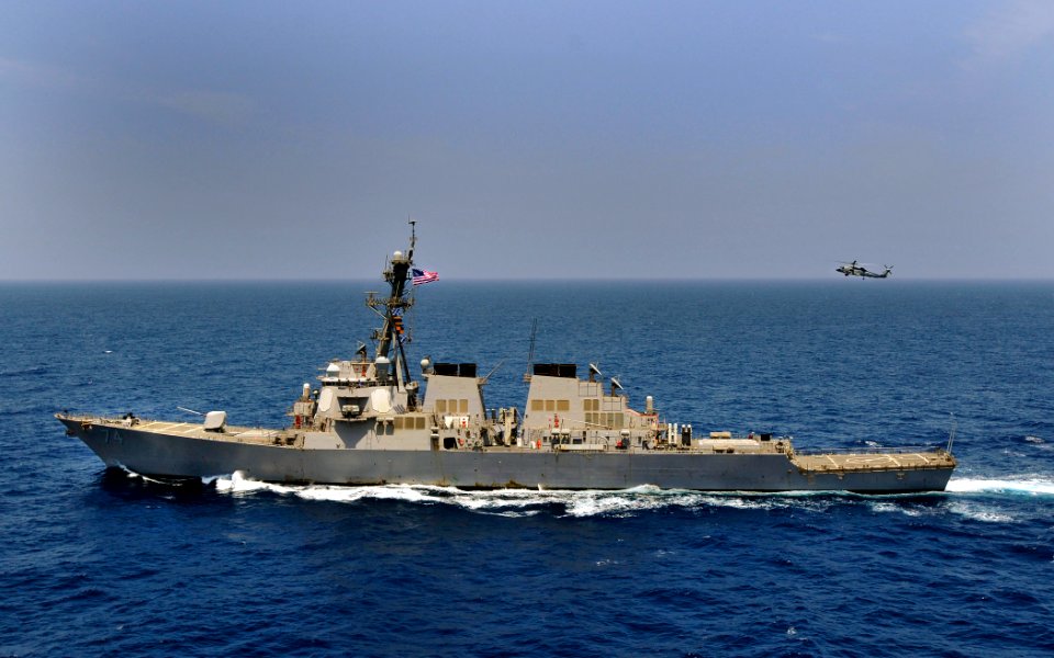 US Navy 100503-N-3595W-010 An SH-60 Sea Hawk helicopter assigned to The Nightdippers of Helicopter Anti-Submarine Squadron (HS) 5 hovers over the guided-missile destroyer USS McFaul (DDG 74)