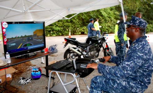 US Navy 100506-N-3436L-001 Chief Master-at-Arms Keevin Pierson tests his motorcycle riding skills on a Honda motorcycle simulator during the 5th annual Recreational Safety Rodeo at Naval Air Station Jacksonville