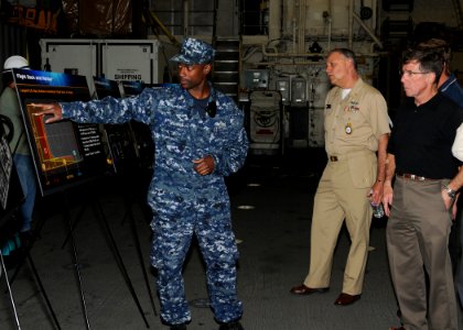US Navy 100503-N-2259P-063 Electronics Technician 1st Class Hasani Thomas explains the flight deck capabilities of the littoral combat ship USS Freedom (LCS 1) photo