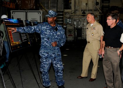 US Navy 100503-N-2259P-063 Electronics Technician 1st Class Hasani Thomas explains the flight deck capabilities of the littoral combat ship USS Freedom (LCS 1)