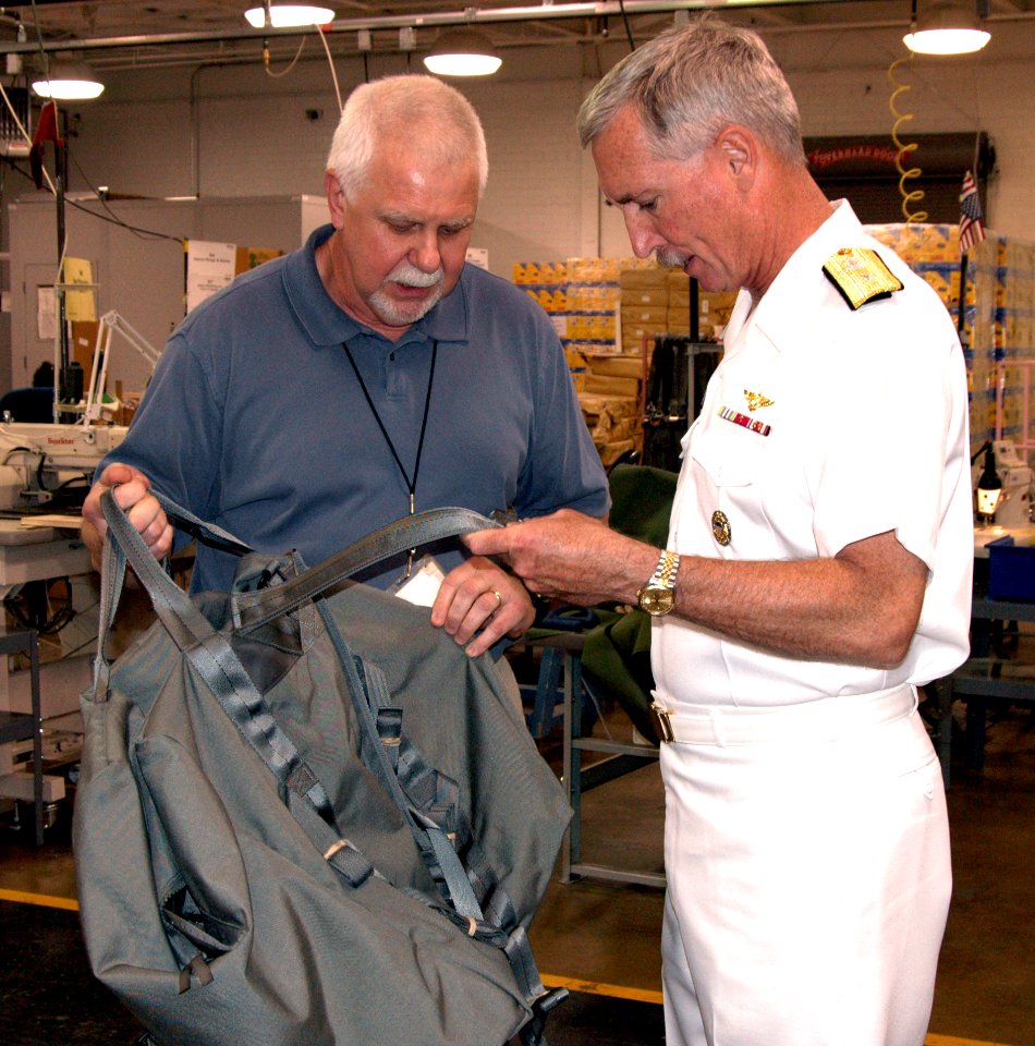 US Navy 100504-N-8497H-058 Rear Adm. Tim Alexander and Charles Roden inspect a new bag during a tour of Alabama Industries for the Blind