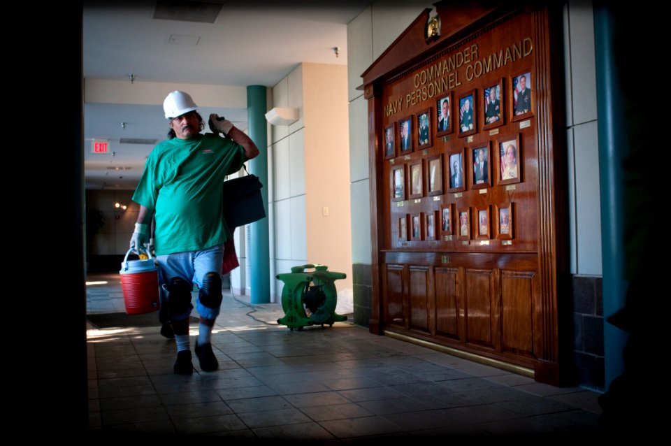 US Navy 100506-N-5319A-004 Local contractors from Millington Tenn. enter the Lassen Building at Naval Support Activity Mid-South during flood recovery operations