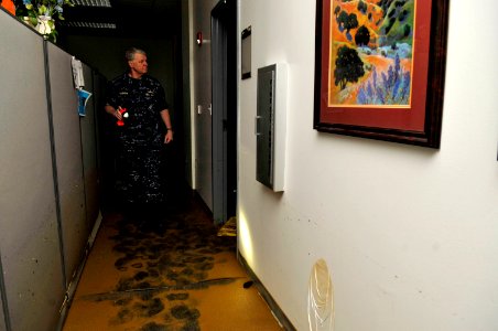 US Navy 100503-N-8273J-058 Chief of Naval Operations (CNO) Adm. Gary Roughead views the damaged buildings at Naval Support Activity Mid-South