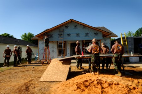 US Navy 100504-N-5208T-004 Seabees assigned to the Naval Mobile Construction Battalion (NMBC) 24 install siding at a Habitat for Humanity construction during a Birmingham Navy Week event