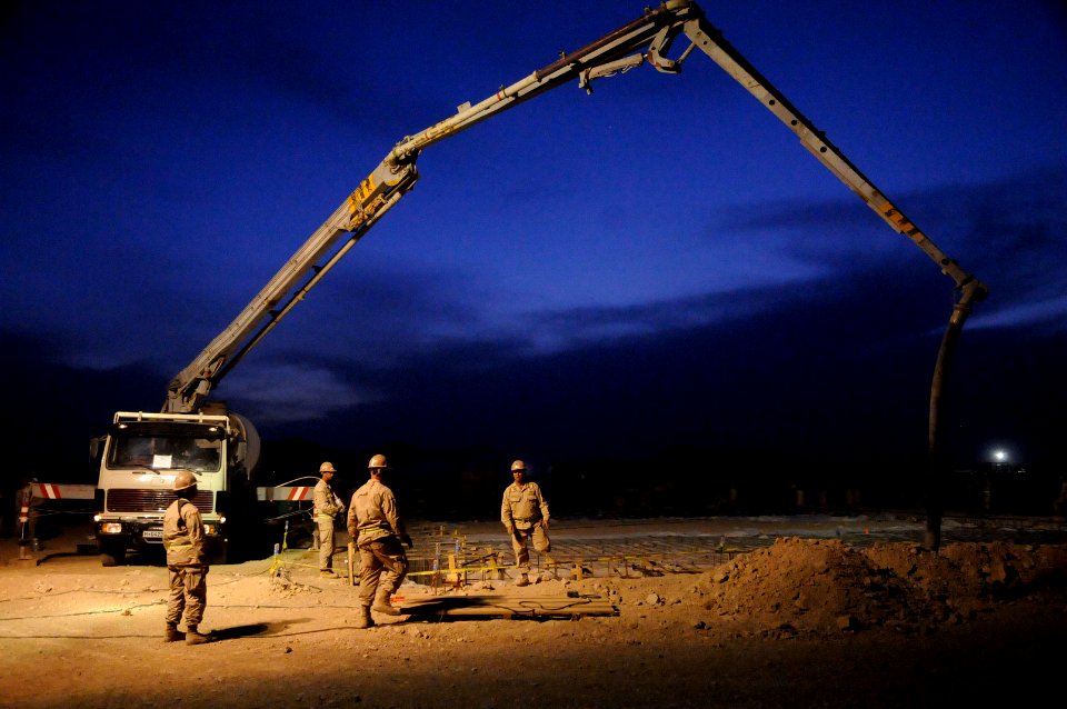 US Navy 100504-N-0475R-317 Seabees assigned to Naval Mobile Construction Battalion (NMCB) 5 prepare to pump concrete for the foundation of a KSPAN building at Camp Leatherneck, Afghanistan