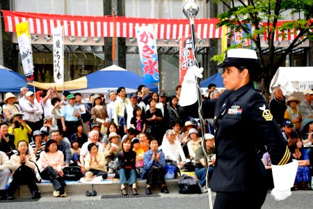 US Navy 100503-N-5086M-134 Chief Musician Luslaida Barbosa leads as drum major for the U.S. 7th Fleet Band's performance in the annual Dontaku Parade