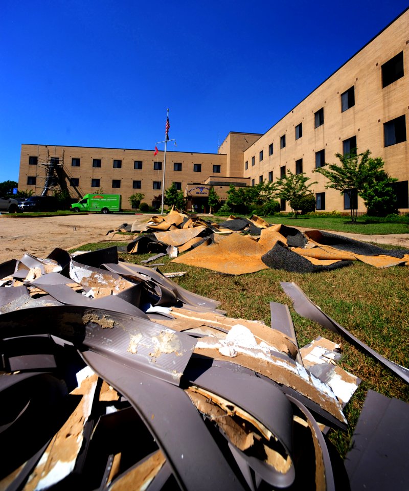 US Navy 100504-N-6046S-048 Recovery crews remove damaged carpet and flooring from building 455 at Naval Support Activity Mid-South during flood recovery operations