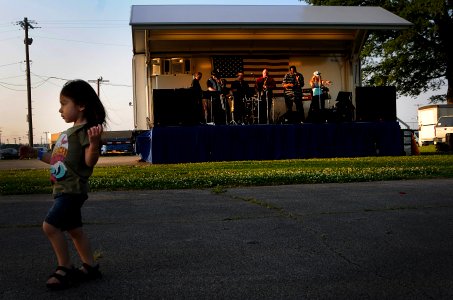 US Navy 100507-N-6046S-077 A child dances and enjoys music from the Memphis-based band, The Distraxshuns, at a free Morale Warfare and Recreation sponsored concert at Naval Support Activity Mid-South