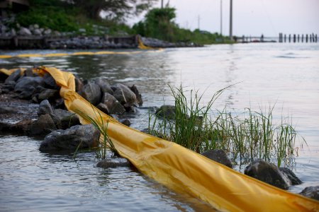US Navy 100504-N-9643K-002 Miles of floating barriers are put in place around Mobile Bay and other sites in the Gulf of Mexico to protect the coastline from a growing oil slick approaching the area from the Deepwater Horizon oi
