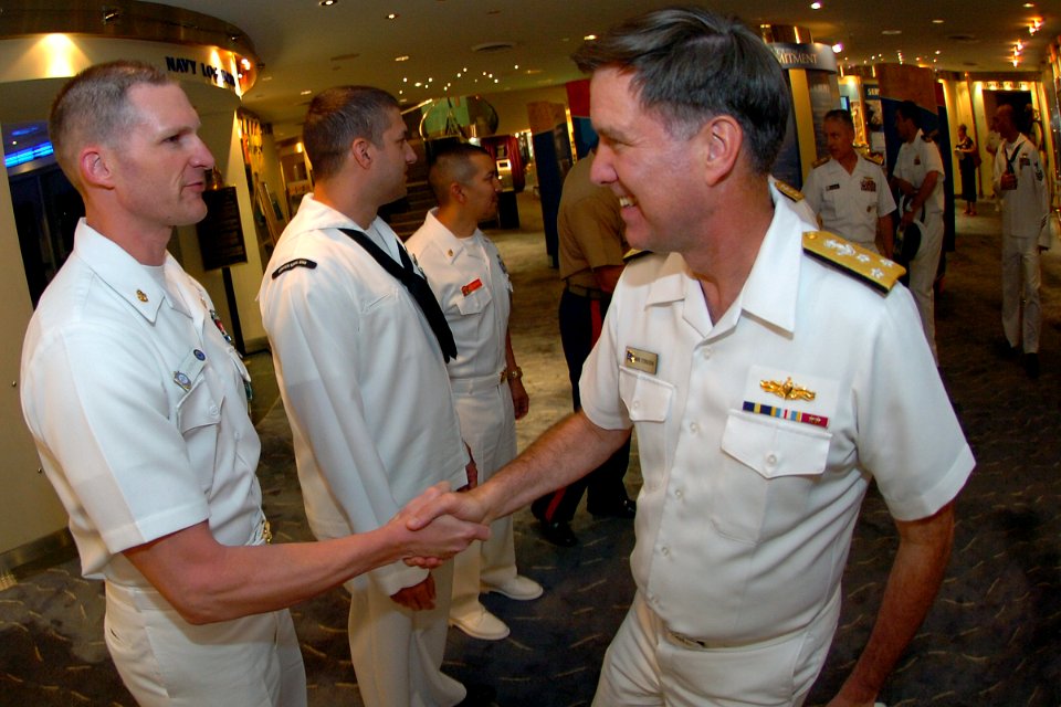 US Navy 100506-N-4482V-007 Vice Adm. Mark E. Ferguson III, Chief of Naval Personnel and Deputy Chief of Naval Operations (Total Force), congratulates Chief Naval Air Crewman Jonathan Showerman