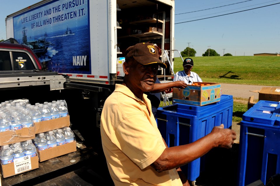 US Navy 100505-N-5862D-008 Roy Barton, a retired Army Sgt. 1st Class, buys food, as well as health and comfort items to donate to flood victims at Naval Support Activity Mid-South