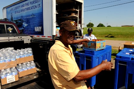 US Navy 100505-N-5862D-008 Roy Barton, a retired Army Sgt. 1st Class, buys food, as well as health and comfort items to donate to flood victims at Naval Support Activity Mid-South