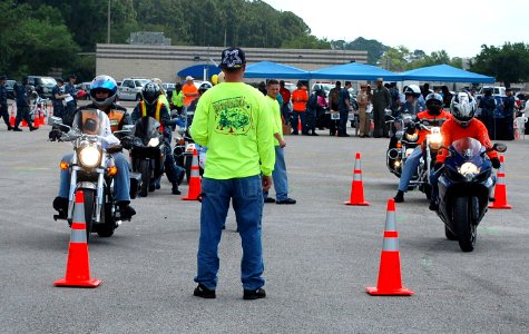 US Navy 100506-N-3436L-002 Motorcyclists participate in a two-lane slow race to test their abilities on the road during the 5th annual Recreational Safety Rodeo at Naval Air Station Jacksonville