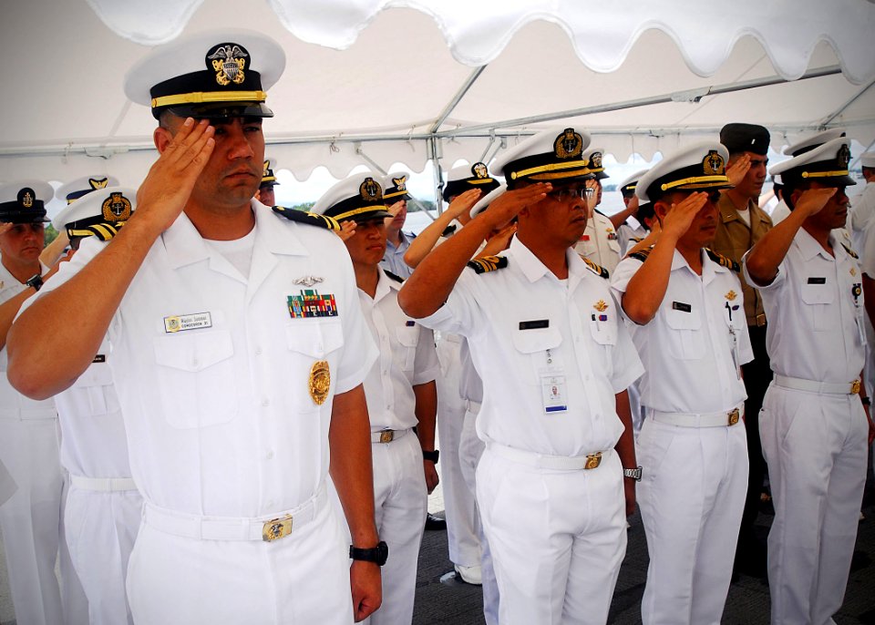 US Navy 100510-N-0995C-070 oyal Brunei and U.S. sailors render a hand salute aboard the amphibious dock landing ship USS Tortuga (LSD 46)