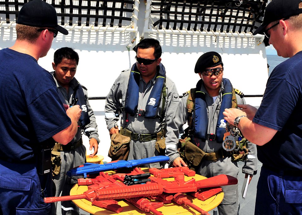 US Navy 100506-N-7643B-049 Guardsmen assigned to the U.S. Coast Guard cutter Mellon (WHEC 717) ready a Royal Brunei Navy boarding team with mock weapons during a visit, board, search, and seizure exercise