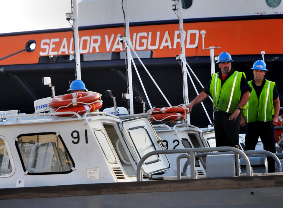 US Navy 100506-N-7367K-001 Personnel assigned to the Supervisor of Salvage and Diving division of Naval Sea Systems Command ready boom handling boats for shipment at the Port of Gulfport as part of the Deepwater Horizon oil spi