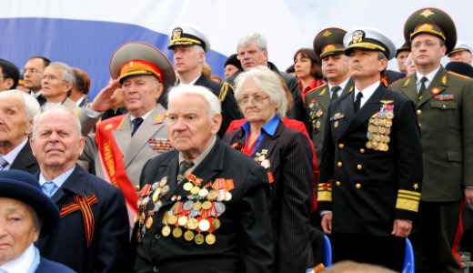 US Navy 100510-N-8288P-047 Vice Adm. Harry B. Harris Jr., commander of the U.S. 6th Fleet, stands at attention among Russian veterans during the opening ceremony at the 65th anniversary of Victory in Europe celebrations photo