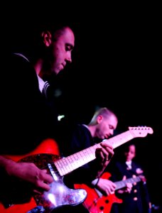 US Navy 100510-N-5716H-409 Musician 1st Class Brian Nefferdorf, assigned to the U.S. 7th Fleet band embarked aboard the U.S. 7th Fleet command ship USS Blue Ridge (LCC 19), performs for competitors and guests of a cooking chall