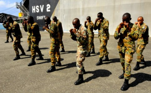 US Navy 100510-N-9643W-552 Members of the Jamaica Defense Force participate in the practical portion of the Marine Corps Martial Arts exchange with U.S. Marine Corps personnel embarked aboard Swift (HSV 2)