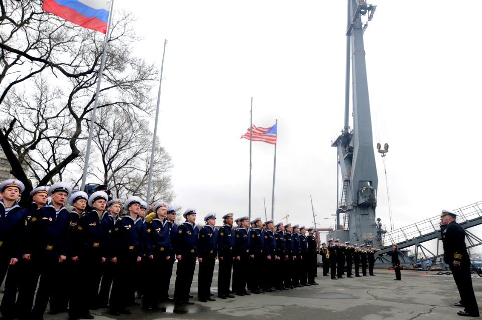 US Navy 100507-N-7280V-341 Capt. Rudy Lupton, commanding officer of the U.S. 7th Fleet command ship USS Blue Ridge (LCC 19), salutes during a performance by Russian navy band members