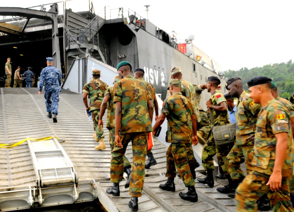 US Navy 100510-N-9643W-038 Jamaica Defense Force sailors board High Speed Vessel Swift (HSV 2) to participate in subject matter exchanges. Swift is deployed supporting Southern Partnership Station 2010 photo