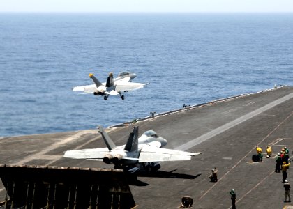 US Navy 100511-N-4236E-352 F-A-18F Super Hornets assigned to the Jolly Rogers of Strike Fighter Squadron (VFA) 103 launch from the aircraft carrier USS Dwight D. Eisenhower (CVN 69)