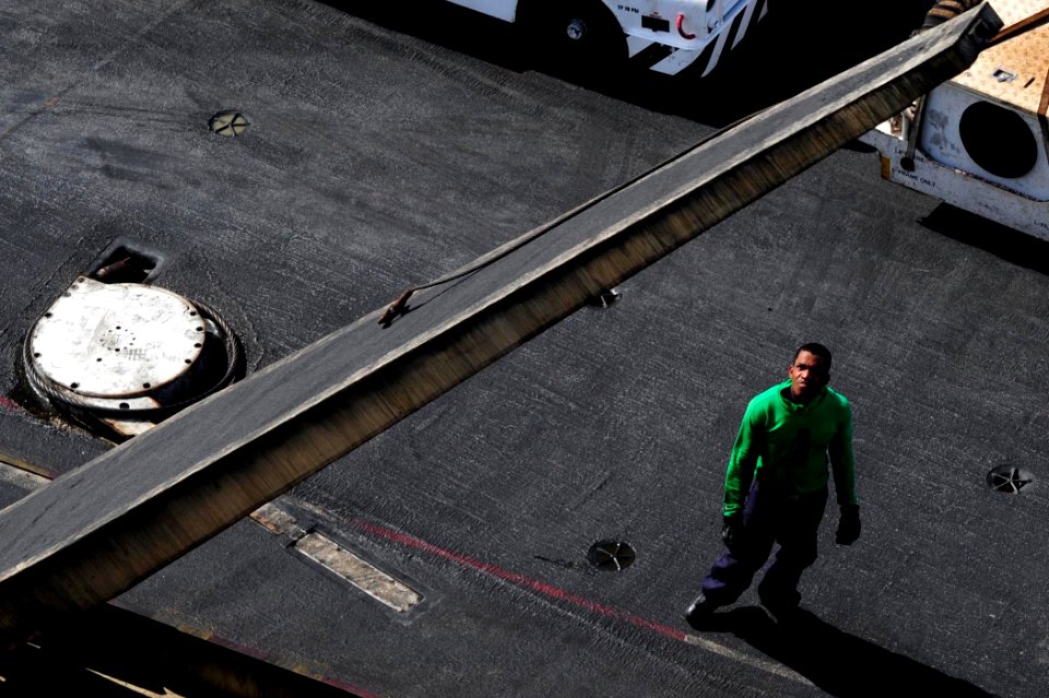 US Navy 100511-N-6604E-064 A Sailor aboard the aircraft carrier USS Dwight D. Eisenhower (CVN 69) inspects the operation function of a barricade stanchion