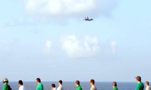 US Navy 100508-N-4236E-115 n F-A-18C Hornet assigned to the Wildcats of Strike Fighter Squadron (VFA) 131 flies by during a foreign object debris walk-down on the flight deck of the aircraft carrier USS Dwight D. Eisenhower (CV