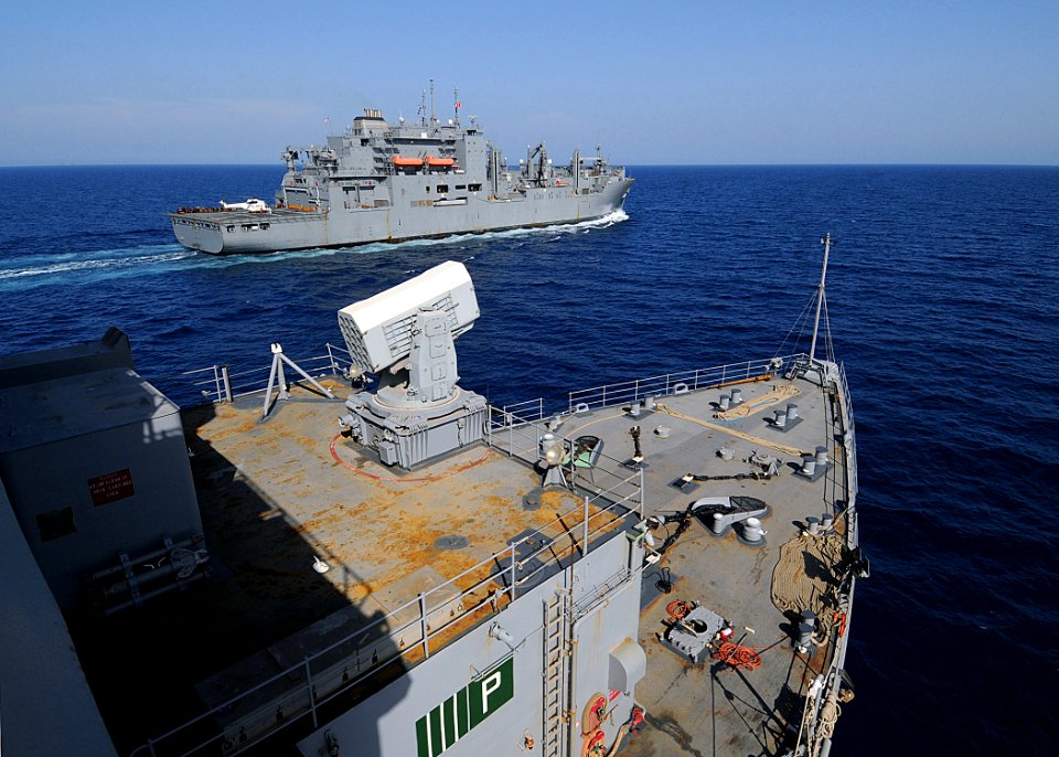 US Navy 100509-N-1082Z-121 The Military Sealift Command dry cargo and ammunition ship USNS Robert E. Peary (T-AKE 5) pulls away from the amphibious dock landing ship USS Ashland (LSD 48)