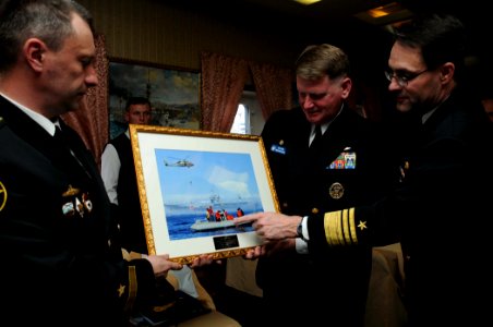 US Navy 100510-N-8721D-003 Vice Adm. John M. Bird and Capt. Rudy Lupton present Capt. 1st Rank Eduard Moskalenko with a gift during a tour of the Russian ship