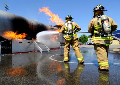 US Navy 100512-N-0775Y-011 Kings County fire fighters battle a fire on a training simulator during Operation Parkview