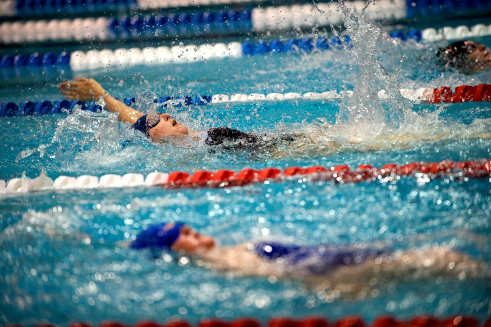 US Navy 100512-N-6932B-560 Navy competitor Lt. Melanie Monts de Oca pulls ahead of the competition during a preliminary swimming event at the inaugural Warrior Games