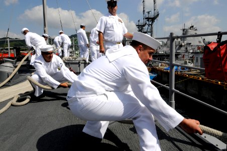 US Navy 100512-N-8335D-157 Sailors heave on mooring lines as the mine countermeasures ship USS Patriot (MCM 7) arrives in Sasebo, Japan at the end of its spring patrol