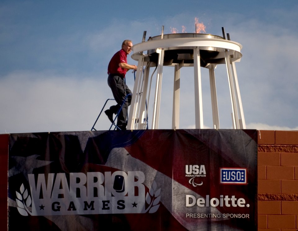 US Navy 100510-N-6932B-151 Navy veteran, Heisman trophy winner and NFL Hall of Fame quarterback Roger Staubach lights the torch at the inaugural Warrior Games at the Olympic Training Center in Colorado Springs, Colo