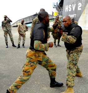 US Navy 100510-N-9643W-733 U.S. Marine Sgt. Geormon Elder spars with a member of the Jamaica Defense Force during the practical portion of the Marine Corps Martial Arts exchange with Marines photo