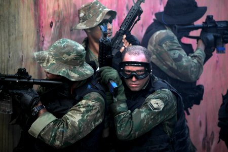 US Navy 100511-N-4205W-194 Members of the Brazilian Marine Corps Special Operations Battalion clear a house using tactics exchanged with U.S. Navy SEALs photo