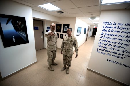 US Navy 100513-N-6463B-032 Capt. Vincent Martinez escorts Rear Adm. Michael P. Tillotson during a tour of spaces and to greet Sailors at Naval Support Activity Bahrain