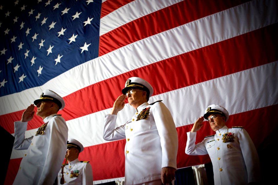 US Navy 100514-N-0807W-084 Vice Adm. H. Denby Starling II, former commander of Navy Cyber Forces and Naval Network Warfare Command leads a salute with the official party as his flag is hauled down