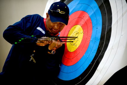 US Navy 100511-N-6932B-157 Chief Electricians Mate Peter Allen Johns retrieves his arrows while practicing for the archery competition at the inaugural Warrior Games in Colorado Springs, Colo