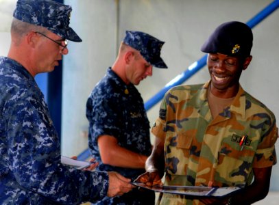 US Navy 100514-N-4971L-035 Team Leaders present certificates of appreciation to a member of the Jamaica Defense Force photo