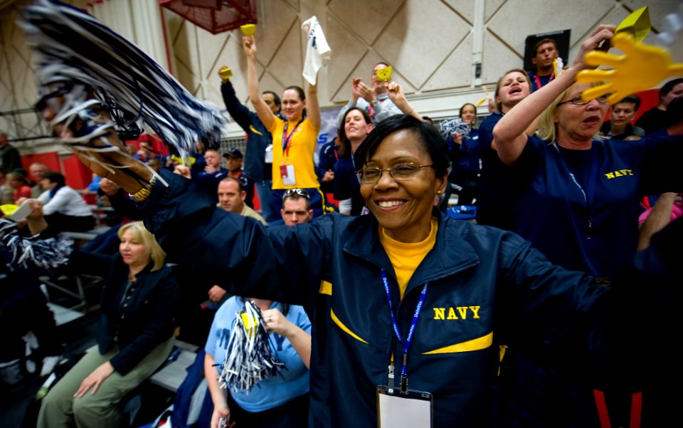 US Navy 100511-N-6932B-295 Bureau of Medicine and Surgery Force Master Chief Laura Martinez and other fans cheer for the Navy sitting volleyball team during their first preliminary game against Army at the inaugural Warrior Gam