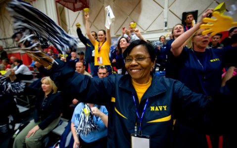 US Navy 100511-N-6932B-295 Bureau of Medicine and Surgery Force Master Chief Laura Martinez and other fans cheer for the Navy sitting volleyball team during their first preliminary game against Army at the inaugural Warrior Gam
