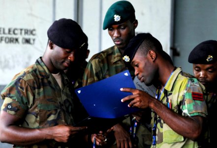 US Navy 100514-N-4971L-083 Members of the Jamaica Defense Force show off their certificates of participation for a weeklong Naval Criminal Investigative Service (NCIS) port security subject matter expert exchange photo