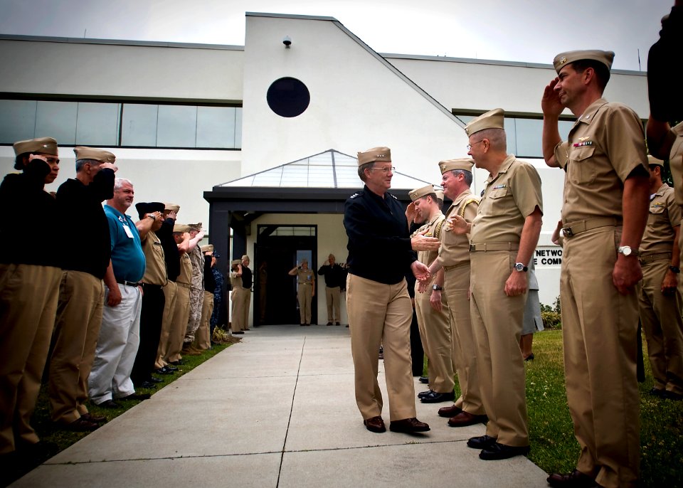 US Navy 100513-N-0807W-014 Vice Adm. H. Denby Starling II, commander of Navy Cyber Forces and Naval Network Warfare Command, shakes hands with his crew during a final walk out from his headquarters at Joint Expeditionary Base L