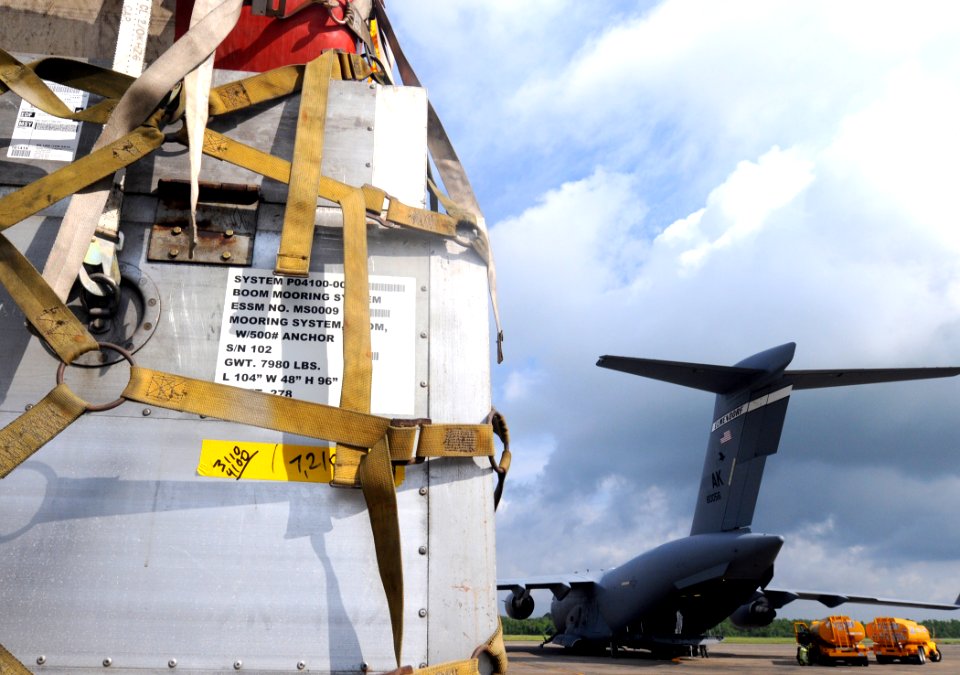 US Navy 100511-N-9712C-002 An Oil containment boom sits on a truck at Naval Air Station Joint Reserve Base New Orleans after being off-loaded from an Air Force C-17 transport aircraft