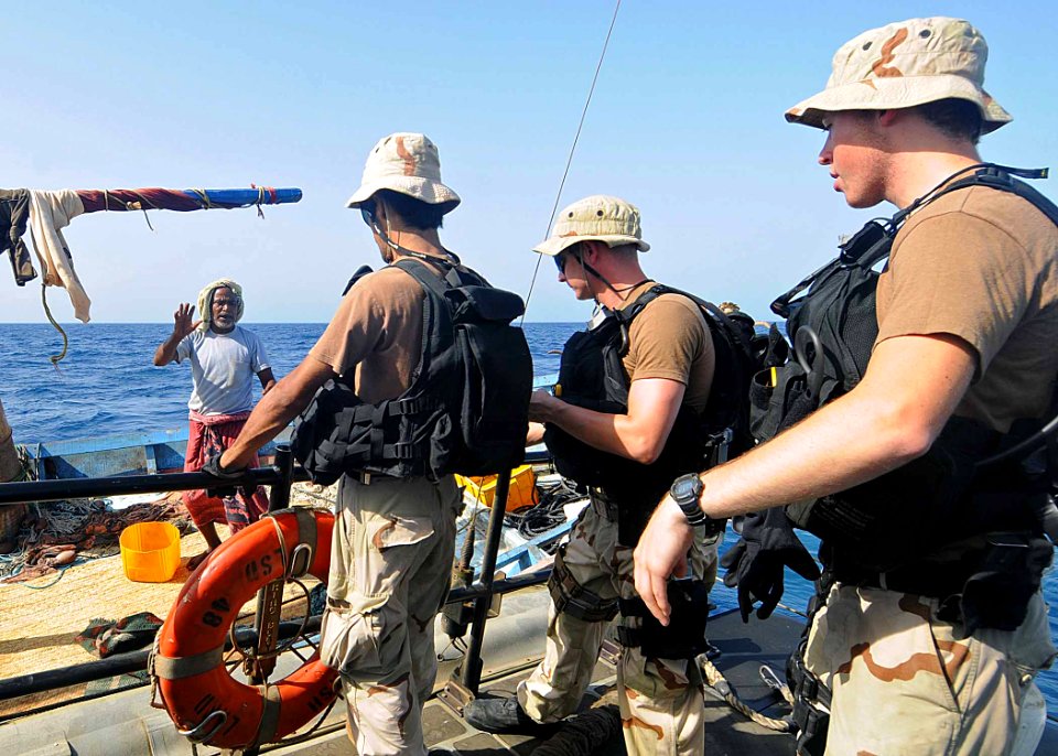 US Navy 100513-N-1082Z-039 Members of the visit, board, search and seizure team from the amphibious dock landing ship USS Ashland (LSD 48) speak with crew members of a fishing dhow