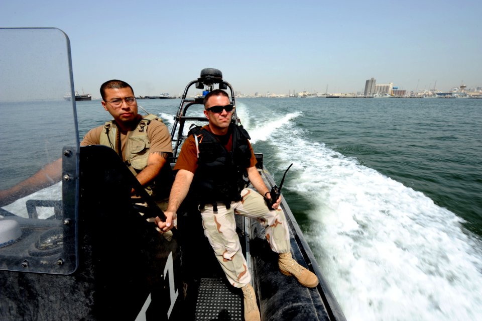 US Navy 100512-N-6463B-023 Chief Master-at-Arms Brandon Parks and Boatswain's Mate 2nd Class Hugo Escobar maintain port security along U.S. and coalition force piers in Bahrain