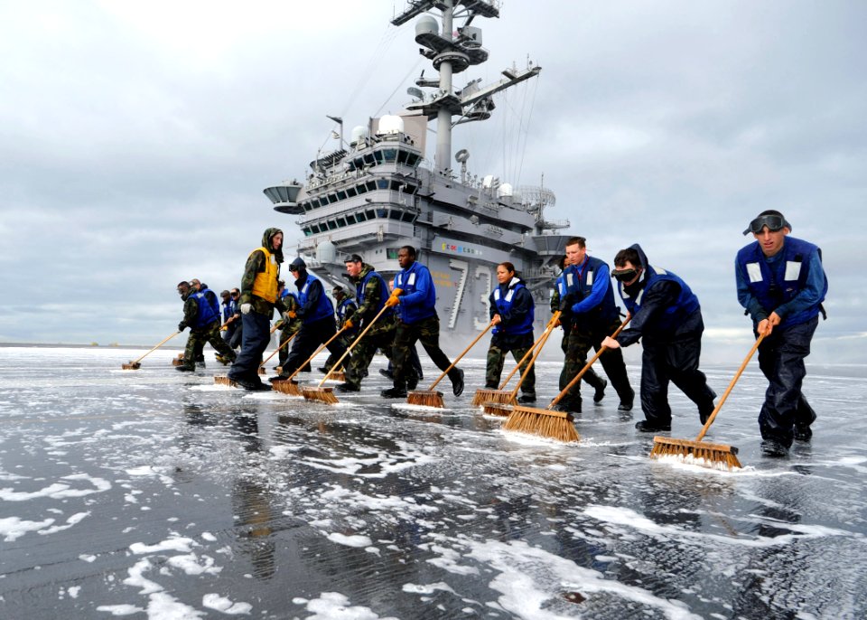 US Navy 100512-N-6720T-033 Air department Sailors scrub the flight deck after validating the shipboard firefighting system