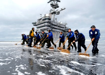 US Navy 100512-N-6720T-033 Air department Sailors scrub the flight deck after validating the shipboard firefighting system